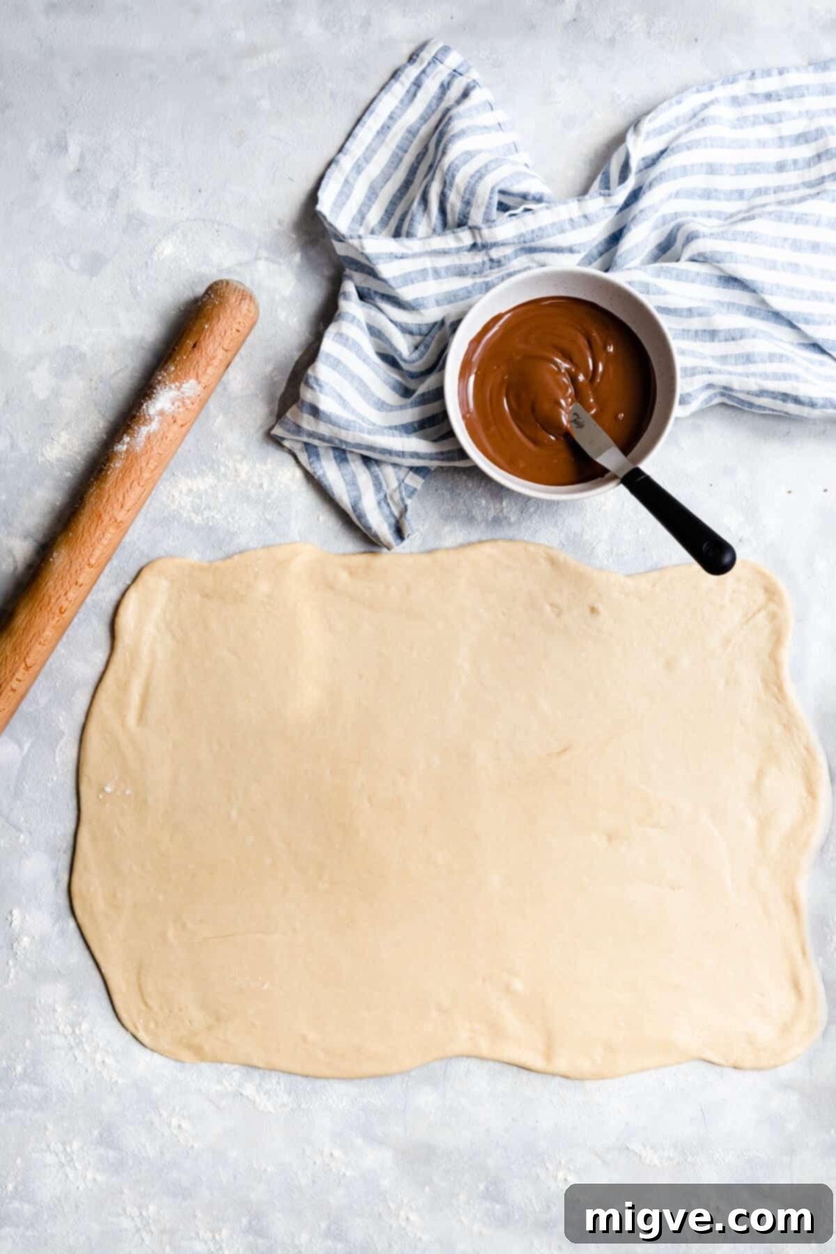 top view of a dough rolled into large rectangle