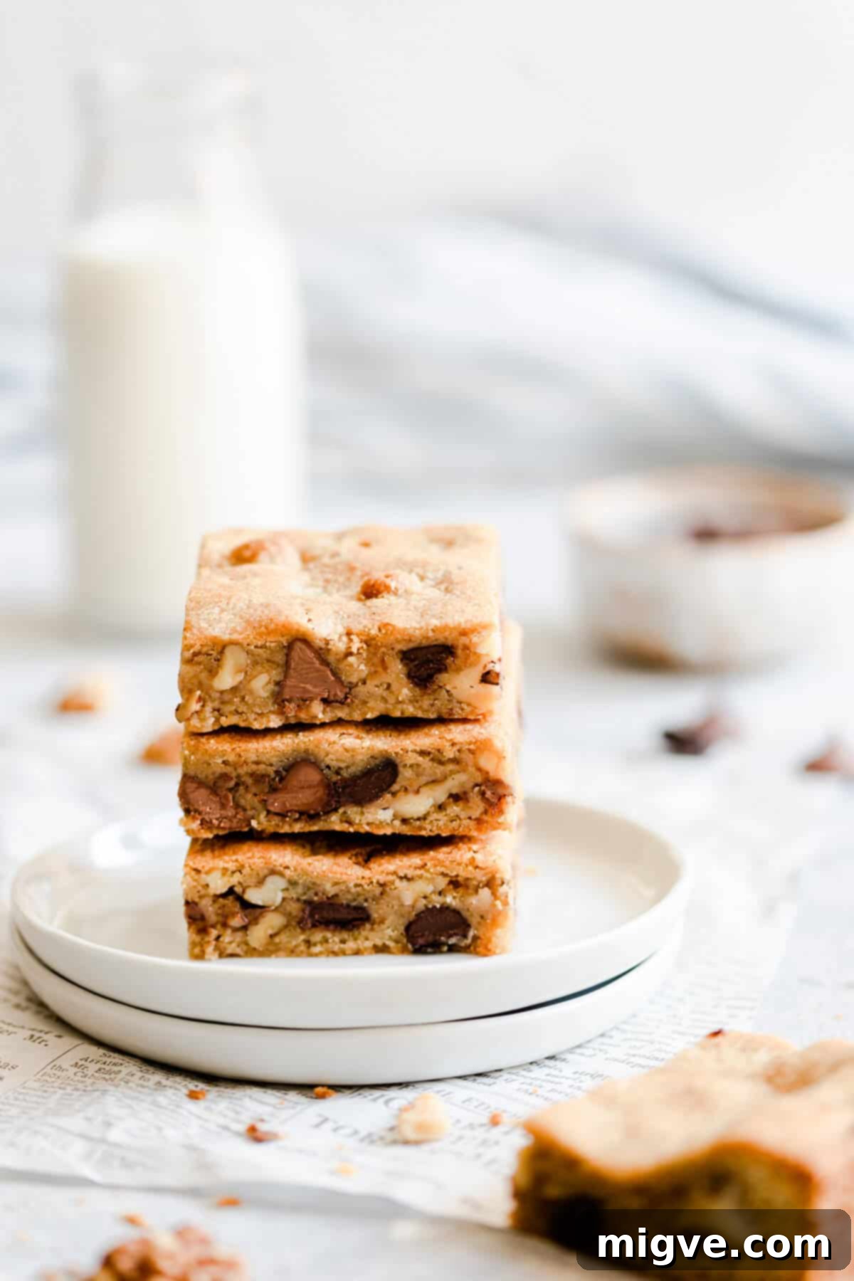 Chocolate Chip and Walnut Blondies 2 Stacked gooey chocolate chip and walnut blondies, showcasing their rich texture
