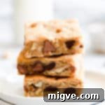 Chocolate Chip and Walnut Blondies 13 Super close up side angle of blondie slices on top of each other