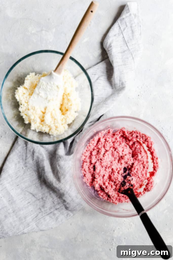 top view of two bowls with different colours of coconut mixture