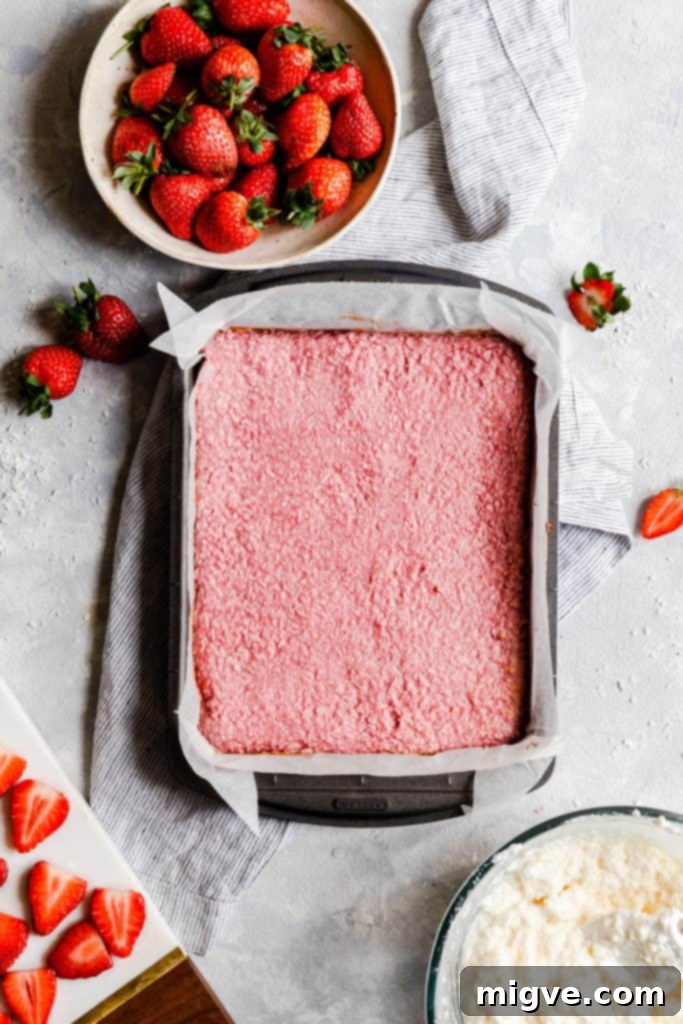 top view of baked strawberry coconut mix in a baking tin