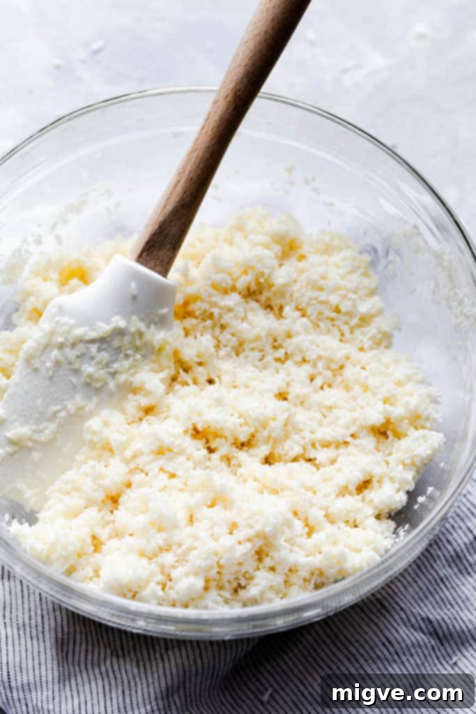 side close up of a bowl with coconut and condensed milk mixture