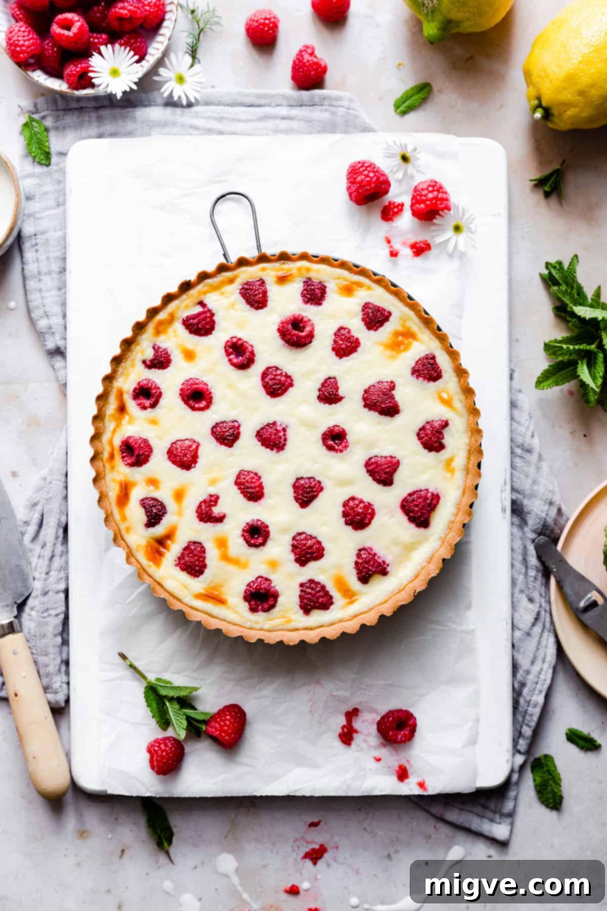 Velvet Raspberry Mascarpone Tart 8 overhead shot of baked raspberry mascarpone tart on white board