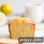 Zesty Small Batch Lemon Drizzle Cake 16 straight ahead close up of lemon cake loaf
