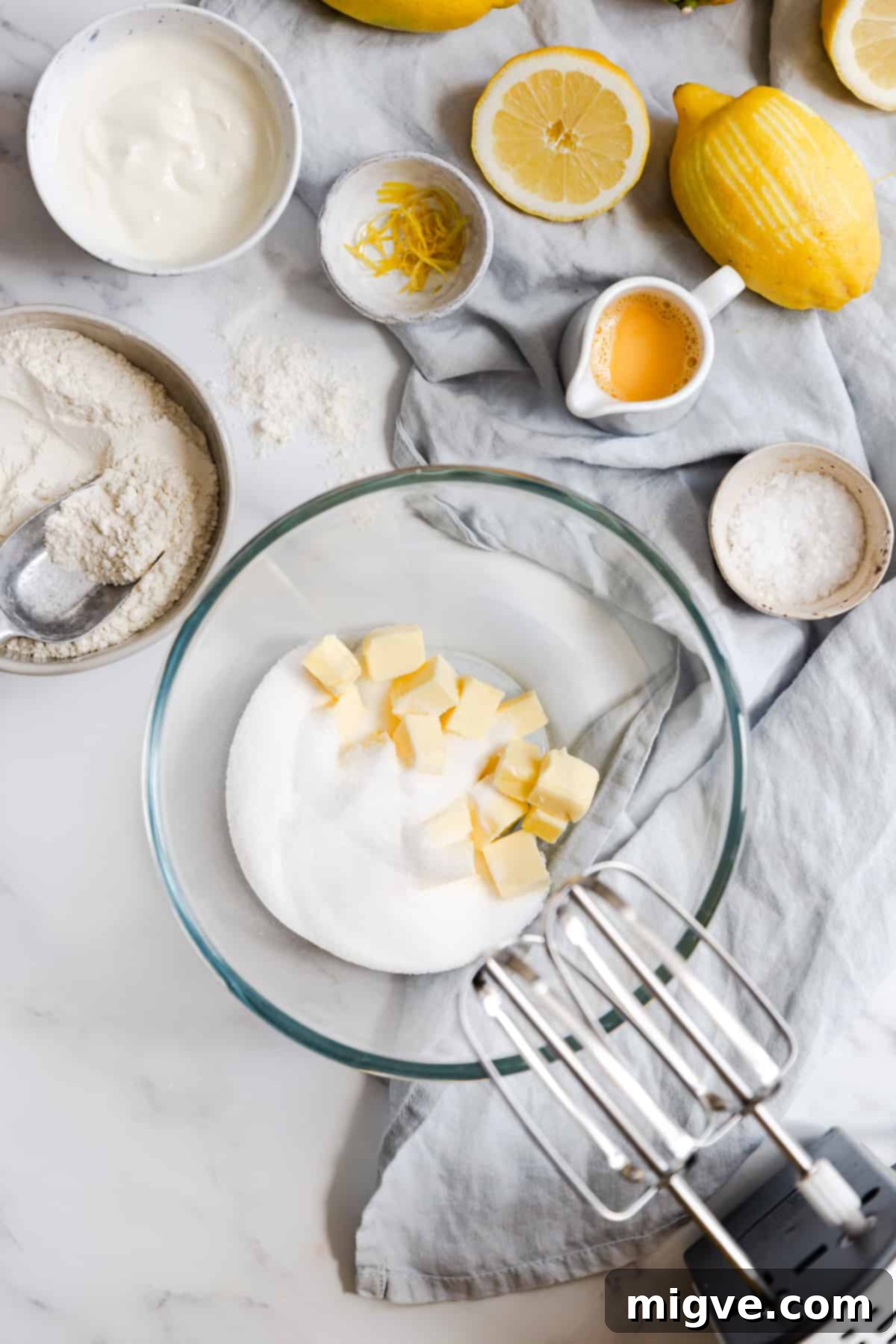 Zesty Small Batch Lemon Drizzle Cake 6 Top view of softened unsalted butter and caster sugar in a mixing bowl, ready to be creamed.