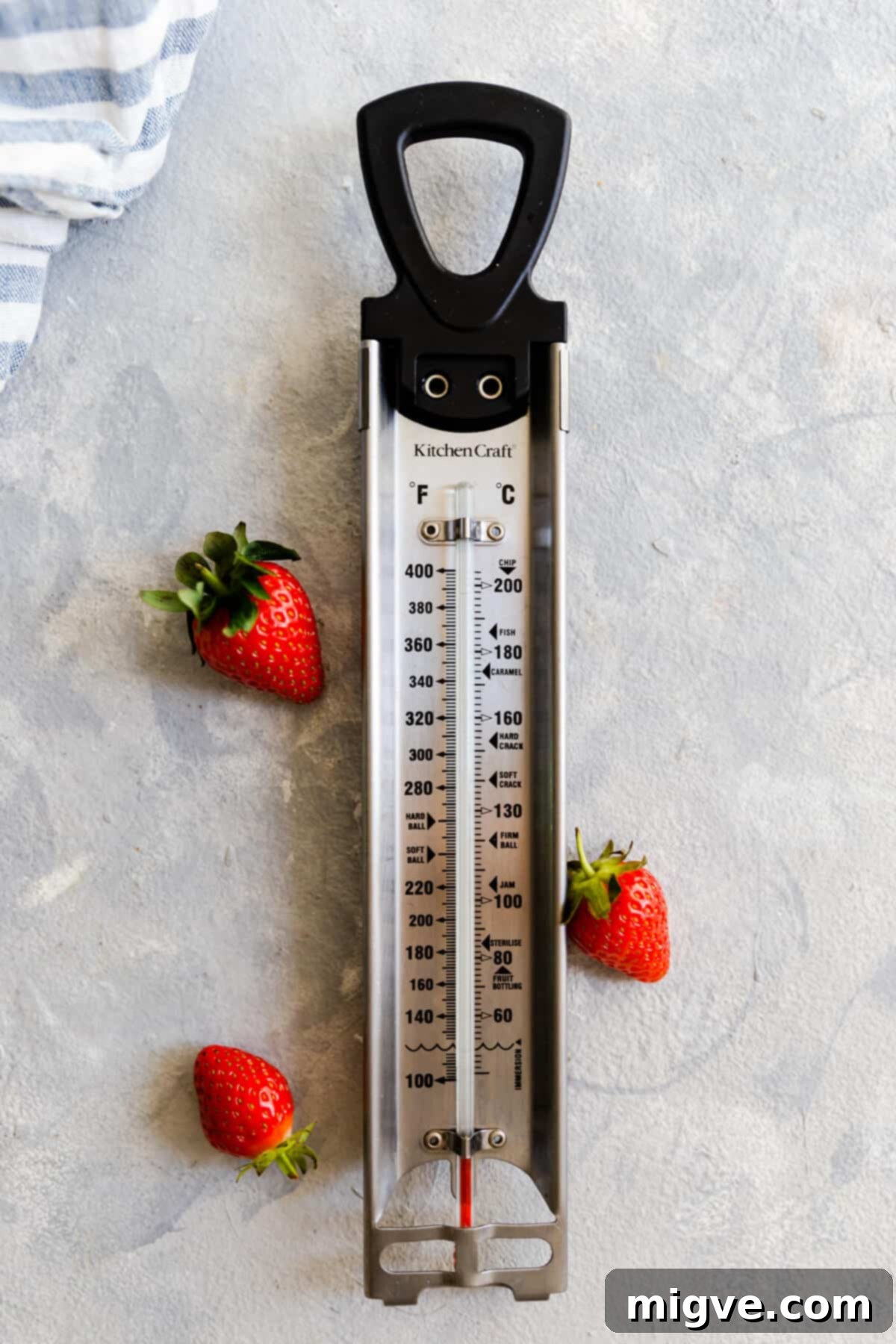 Effortless Strawberry Sunshine 7 top view of a kitchen thermometer with few strawberries next to it