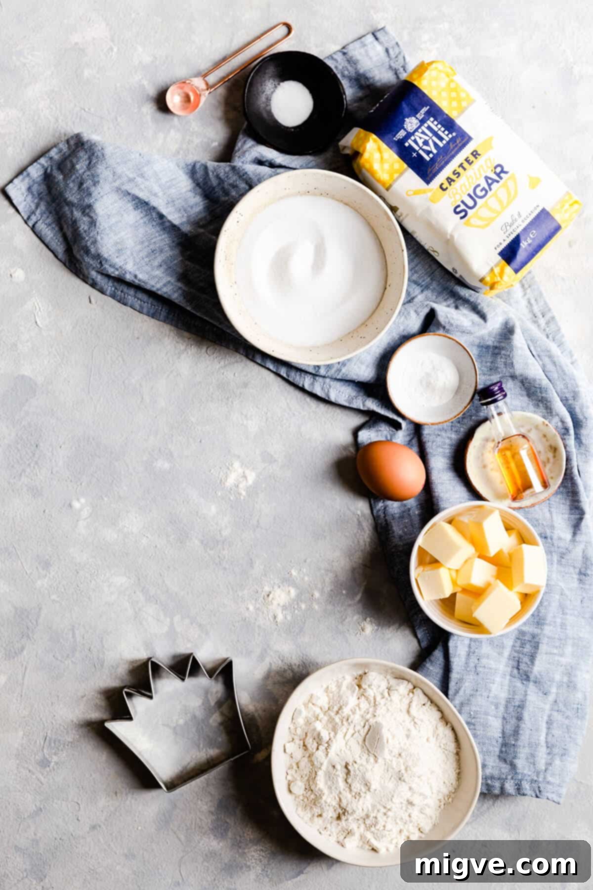 Celebration Sugar Cookie Delights 5 A top-down view of the essential seven ingredients laid out for making birthday sugar cookies, emphasizing simplicity.