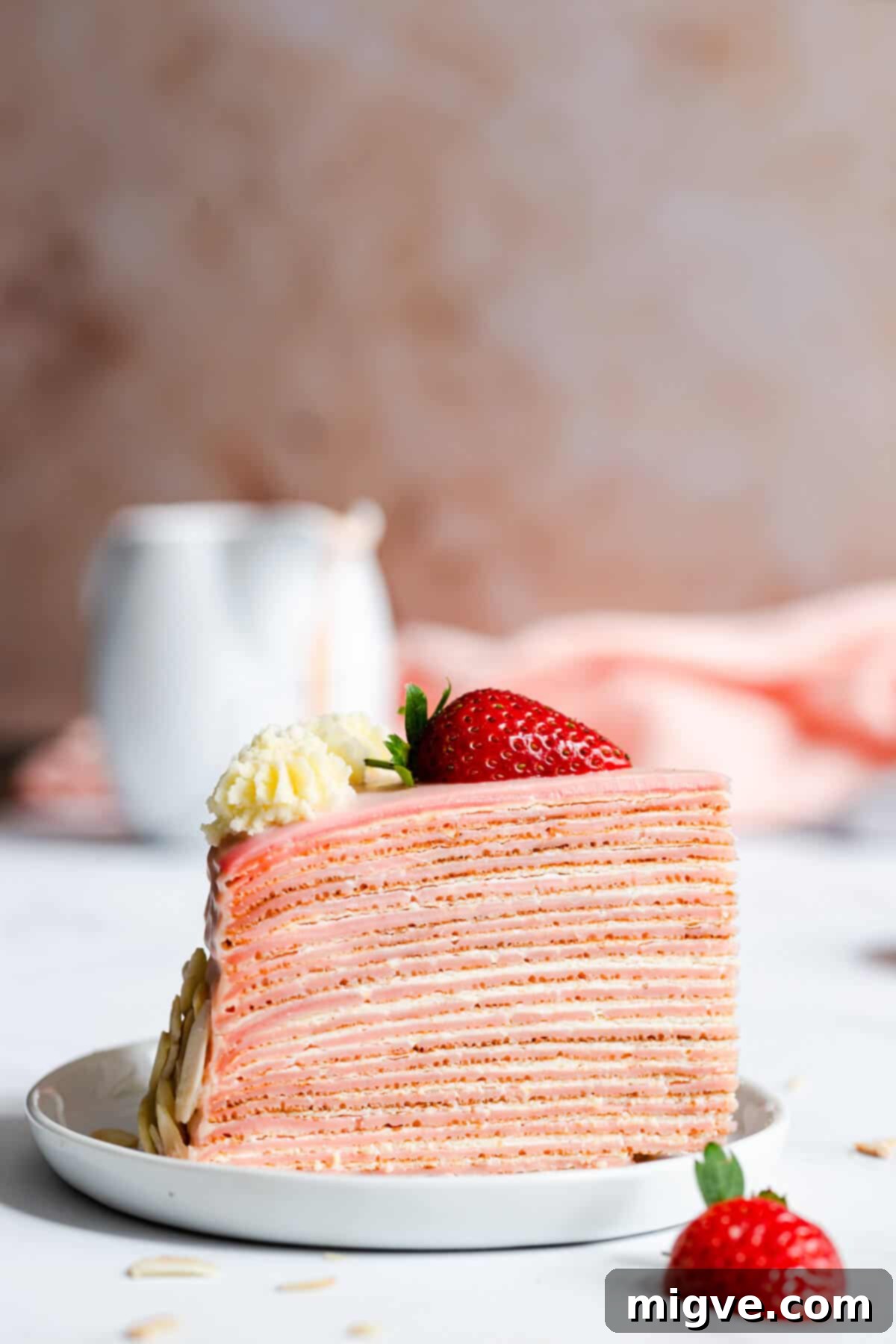 super close up of a slice of crepe cake on a small plate