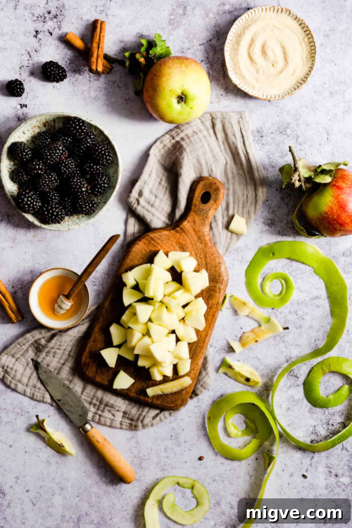 overhead shot of chopped apples on a small chopping board