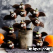 Midnight Marshmallow Bats 11 chocolate marshmallow bats on skewers inside of the metal jug