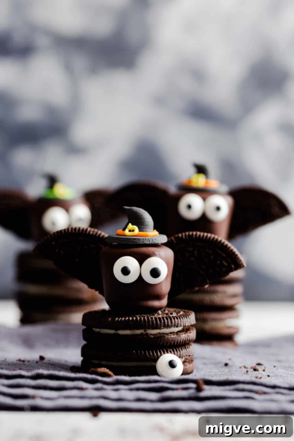 Midnight Marshmallow Bats 3 super close up at chocolate bat wearing a witches hat, standing on Oreo cookies