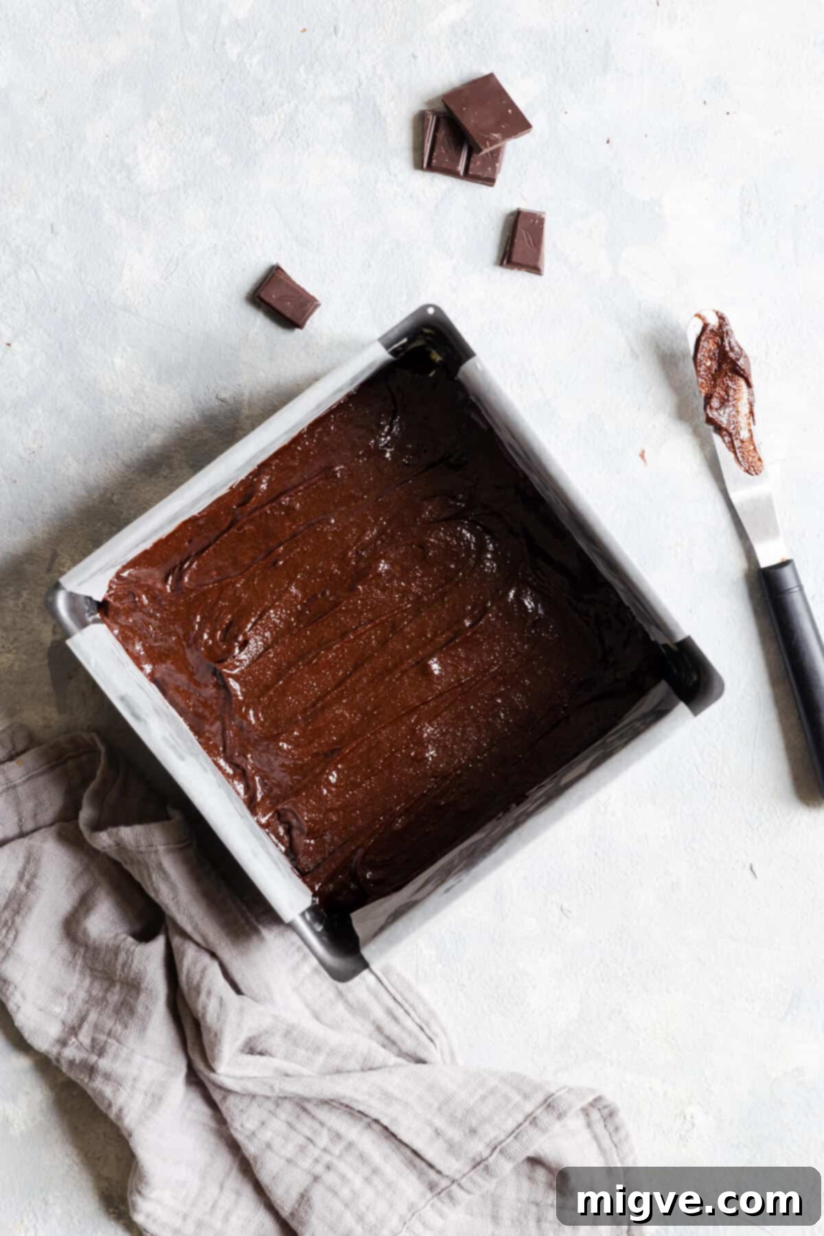 overhead shot of brownie batter in a baking tin