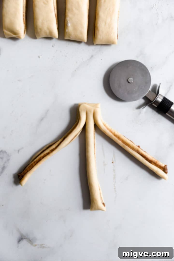 top view of a strip of dough sliced into three strands