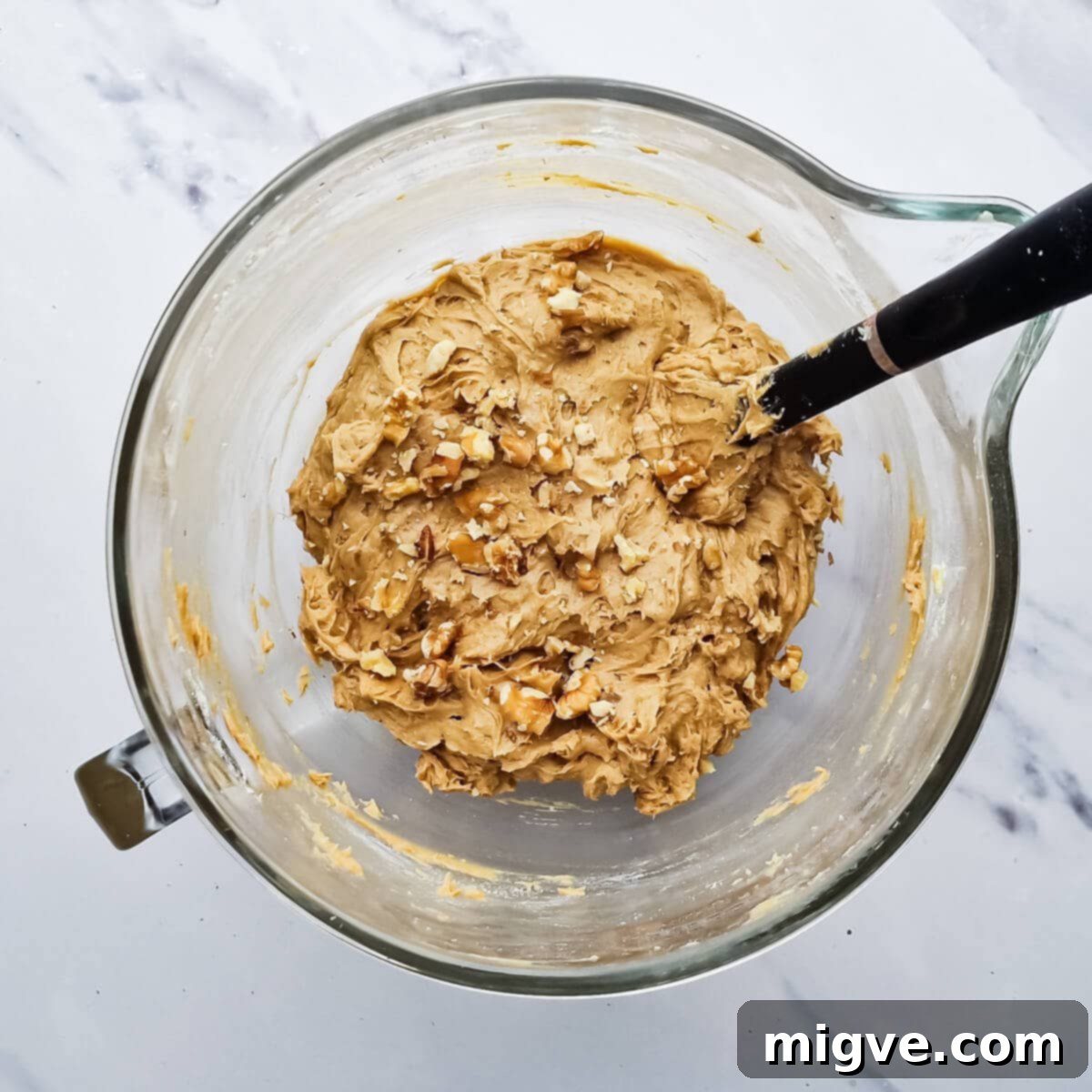 a bowl with the batter for coffee and walnut cake.