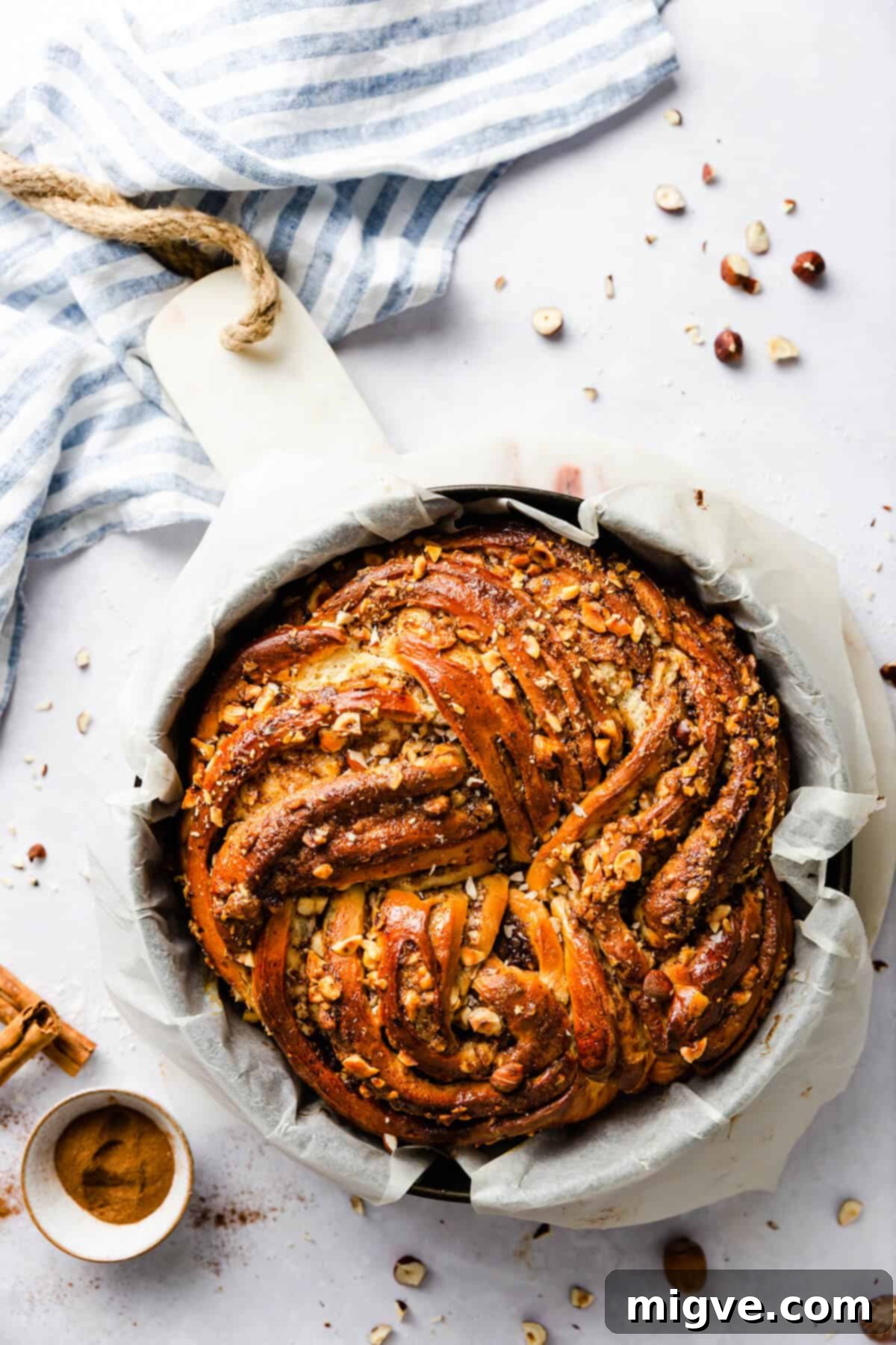 overhead shot of baked cinnamon bread inside of the baking tin
