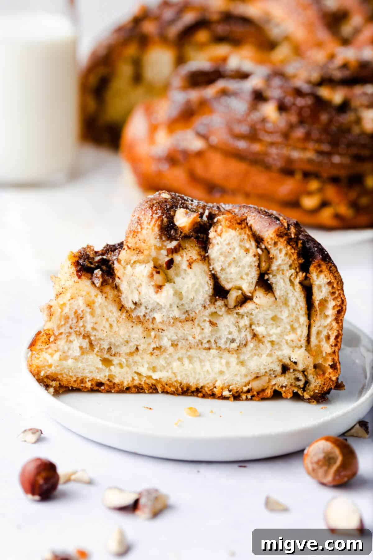 side super close up of a slice of cinnamon and hazelnut bread on a small plate