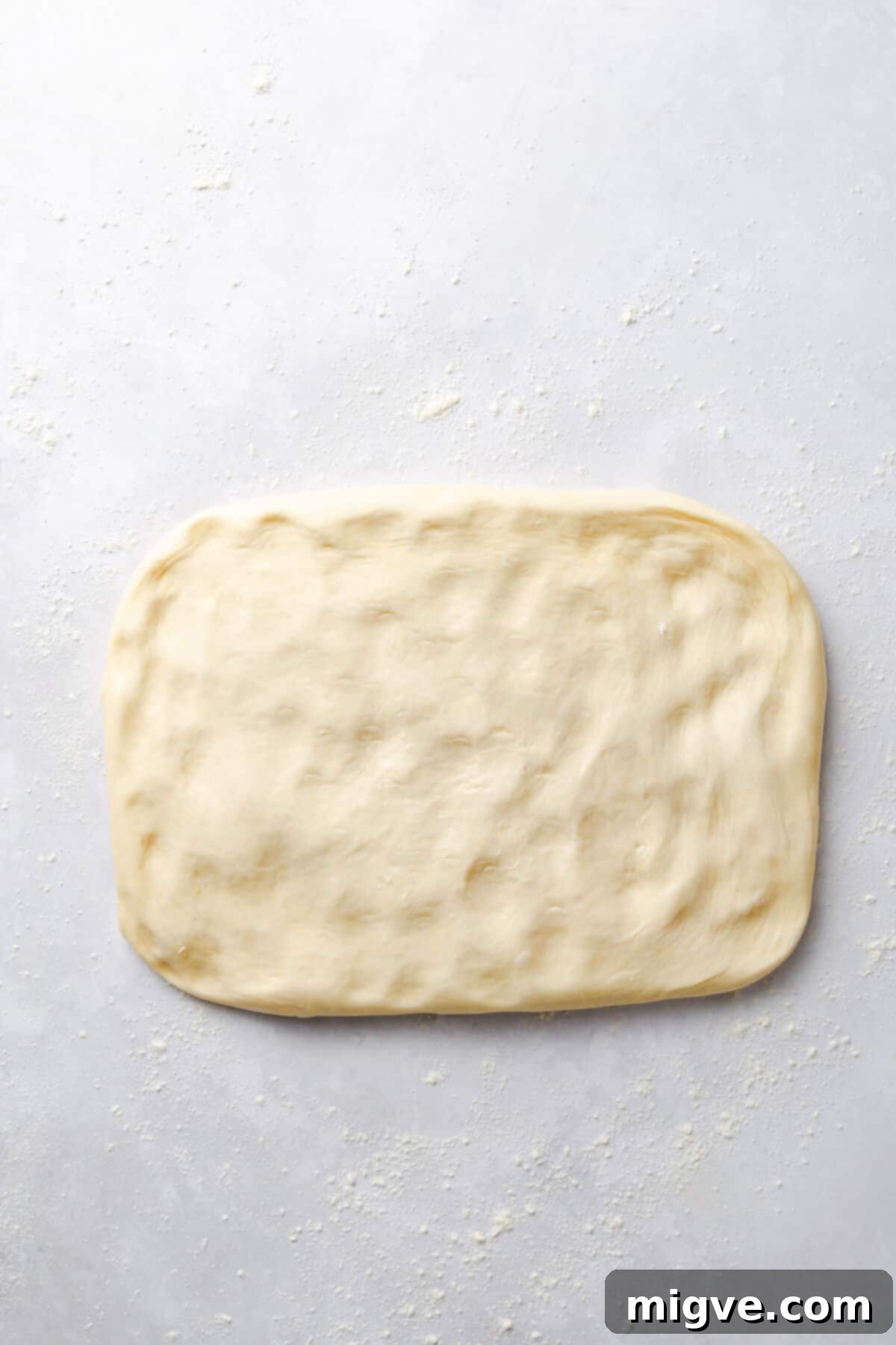 top view of soft dough stretched into rectangle