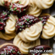 Buttery Danish Cookie Perfection 13 danish butter cookies dipped in chocolate and topped with festive sprinkles.