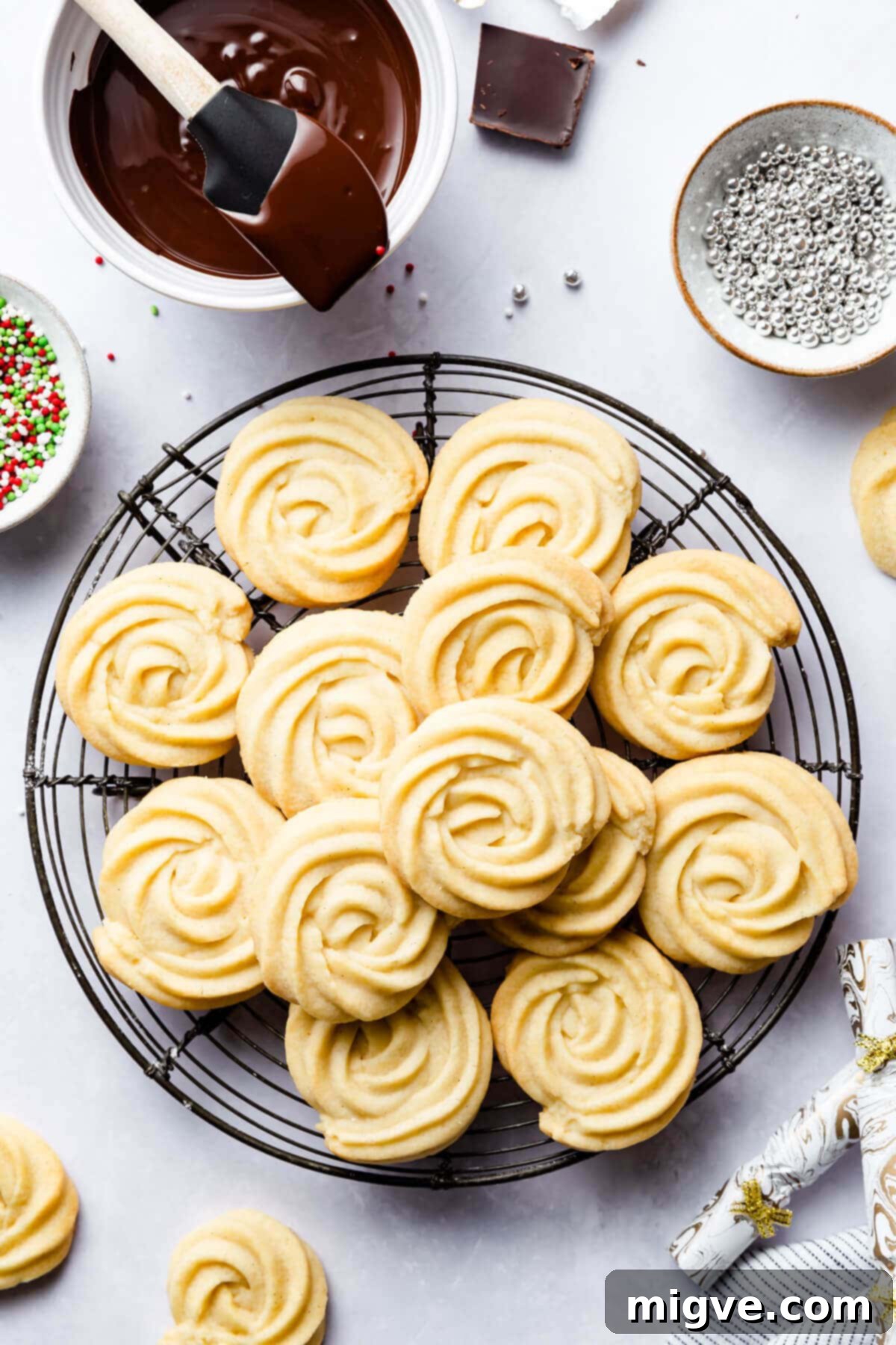 Buttery Danish Cookie Perfection 10 Freshly baked plain Danish butter cookies cooling on a metal wire rack.