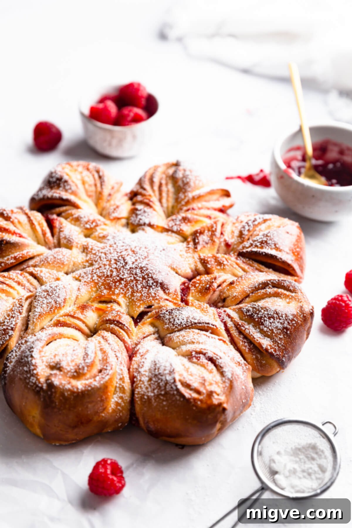 side close up at a festive star bread with raspberries