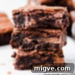 Foolproof Fudgy Brownies 9 straight ahead super close-up of 3 chocolate brownies stacked on top of each other