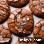 top view super close up of chocolate brownie cookie with flaked sea salt on top