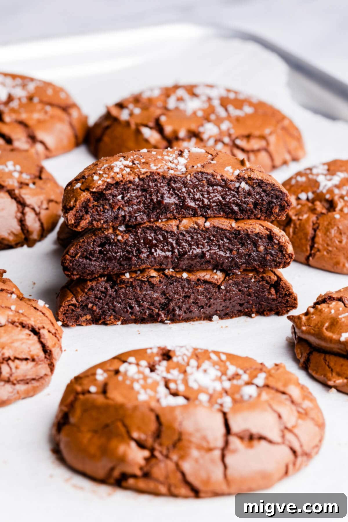 side angle close up at stack of 3 brownie cookies cut in half