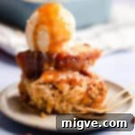 straight ahead super close up at banana pudding with scoop of ice cream on top