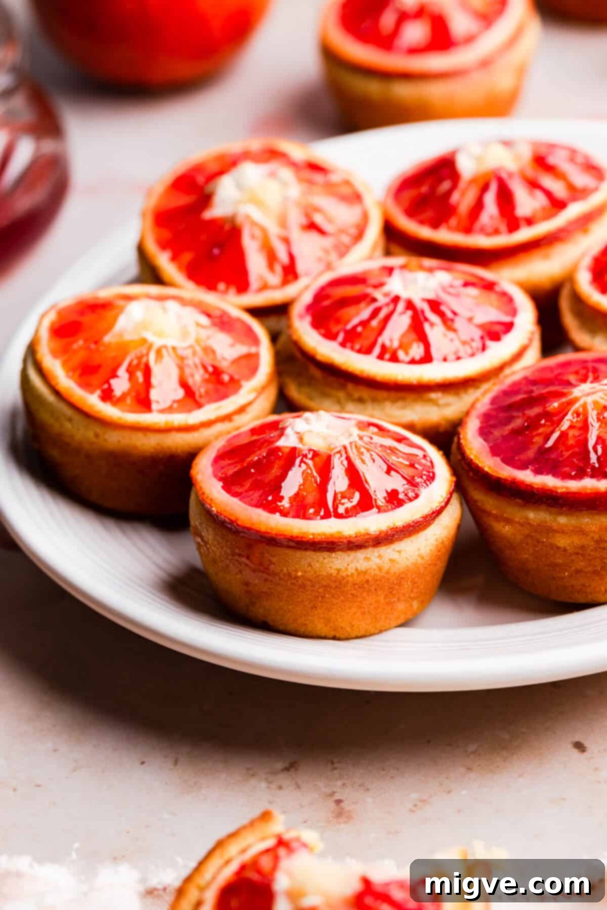 straight ahead angle photo of blood orange and semolina cakes on a plate