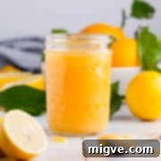 Handcrafted Lemon Zest Delight 14 straight ahead photo of a jar filled with lemon curd