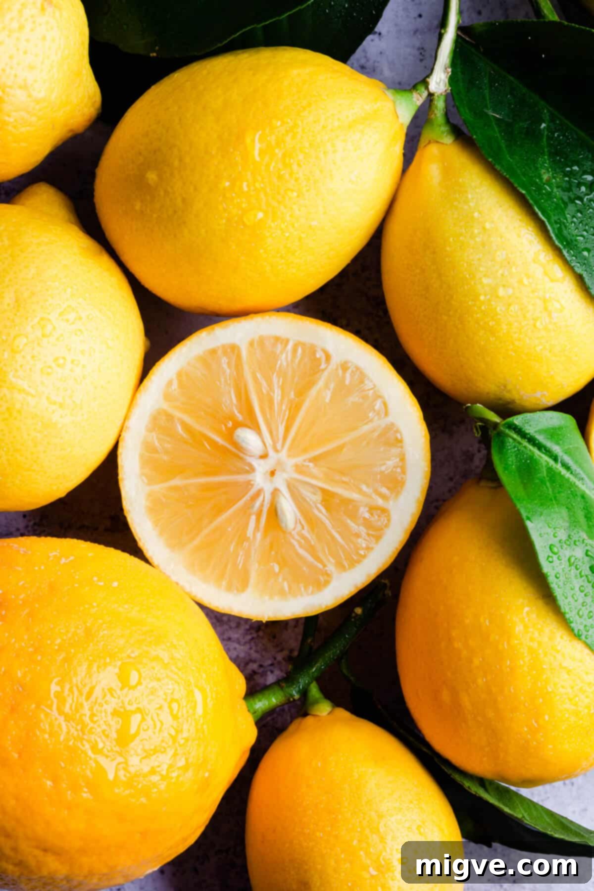 Handcrafted Lemon Zest Delight 4 top view super close up at fresh lemon half surrounded by whole lemons