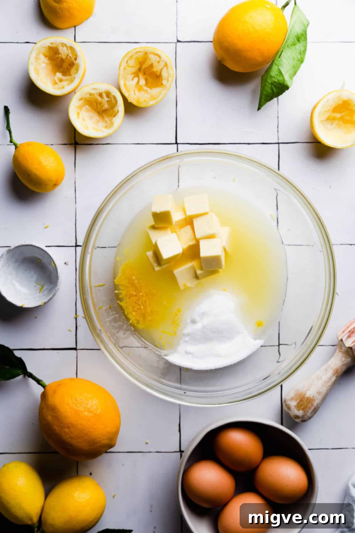 Handcrafted Lemon Zest Delight 6 top view image of a large bowl filled with some of the ingredients for the fruit curd