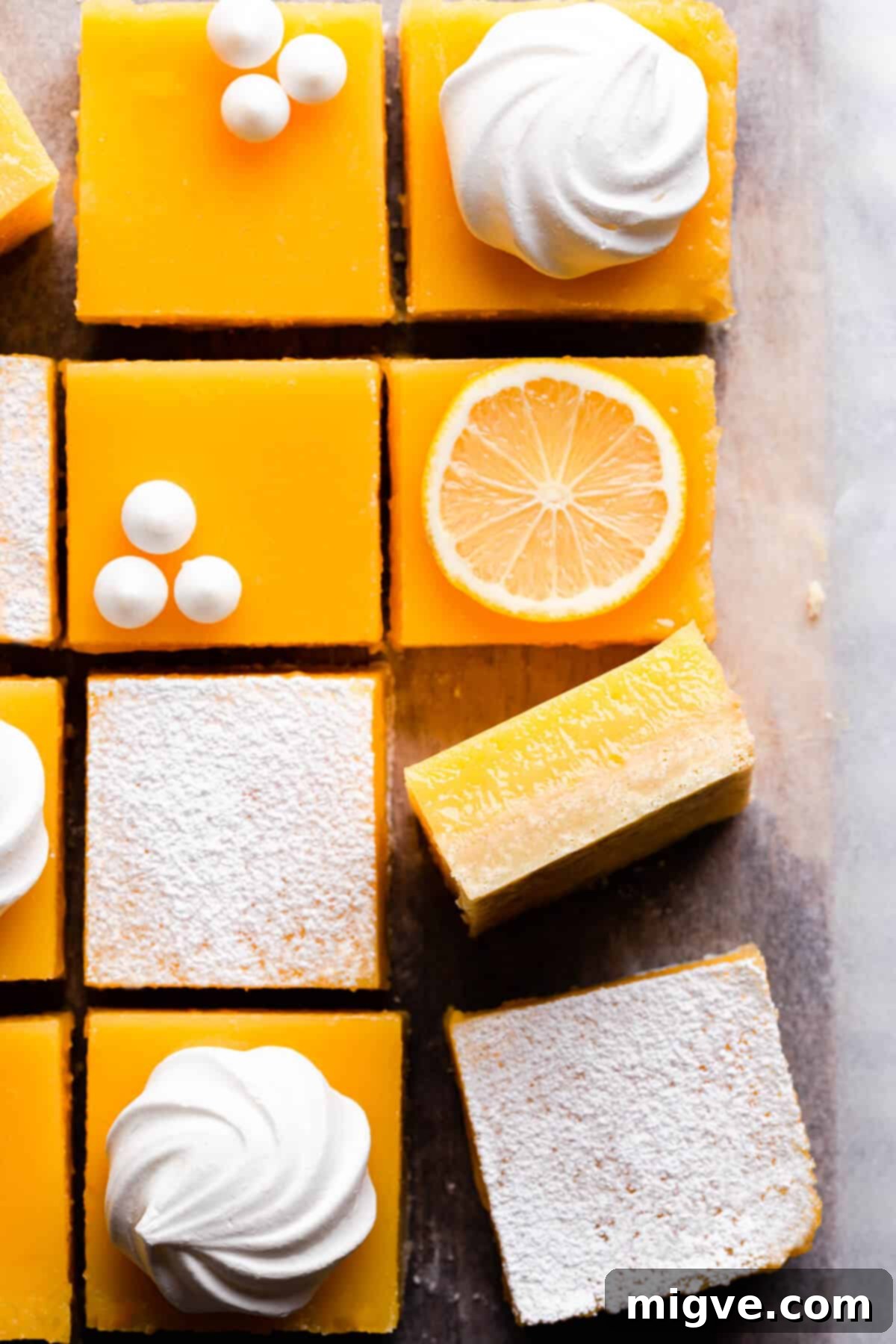 Top view close up of a lemon curd slice turned on its side, showing the distinct layers of crust and filling.