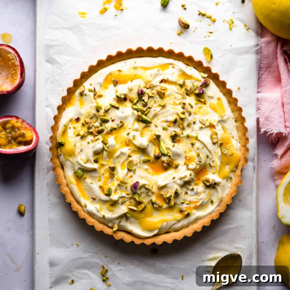 lemon mascarpone tart topped with lemon curd and chopped pistachios.