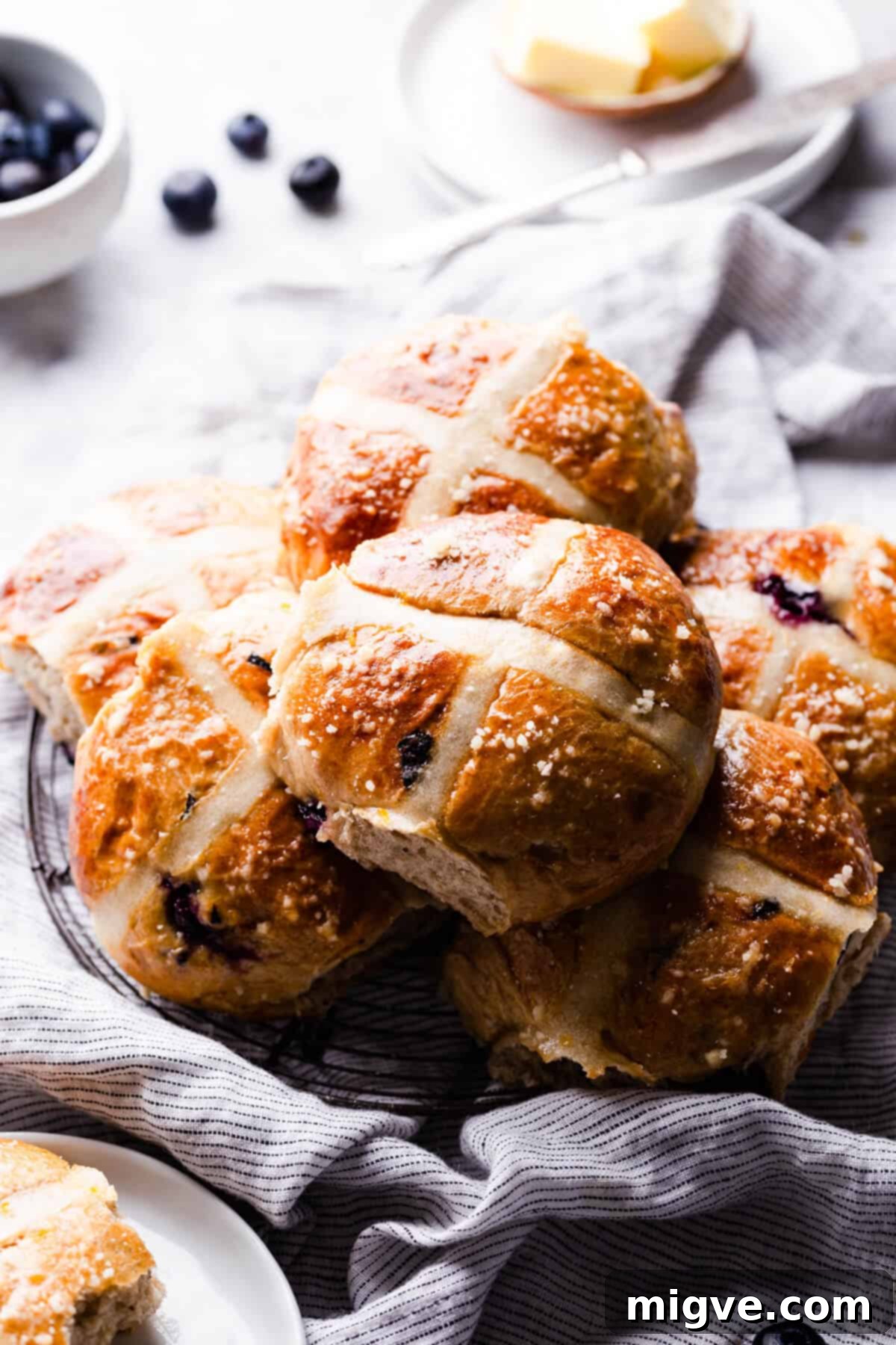 Luscious Blueberry Hot Cross Buns 11 side angle of blueberry hot cross buns on a cooling rack
