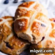 Luscious Blueberry Hot Cross Buns 14 super close up at a hot cross bun with shiny glaze