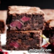 super close up at two slices of chocolate cherry brownies