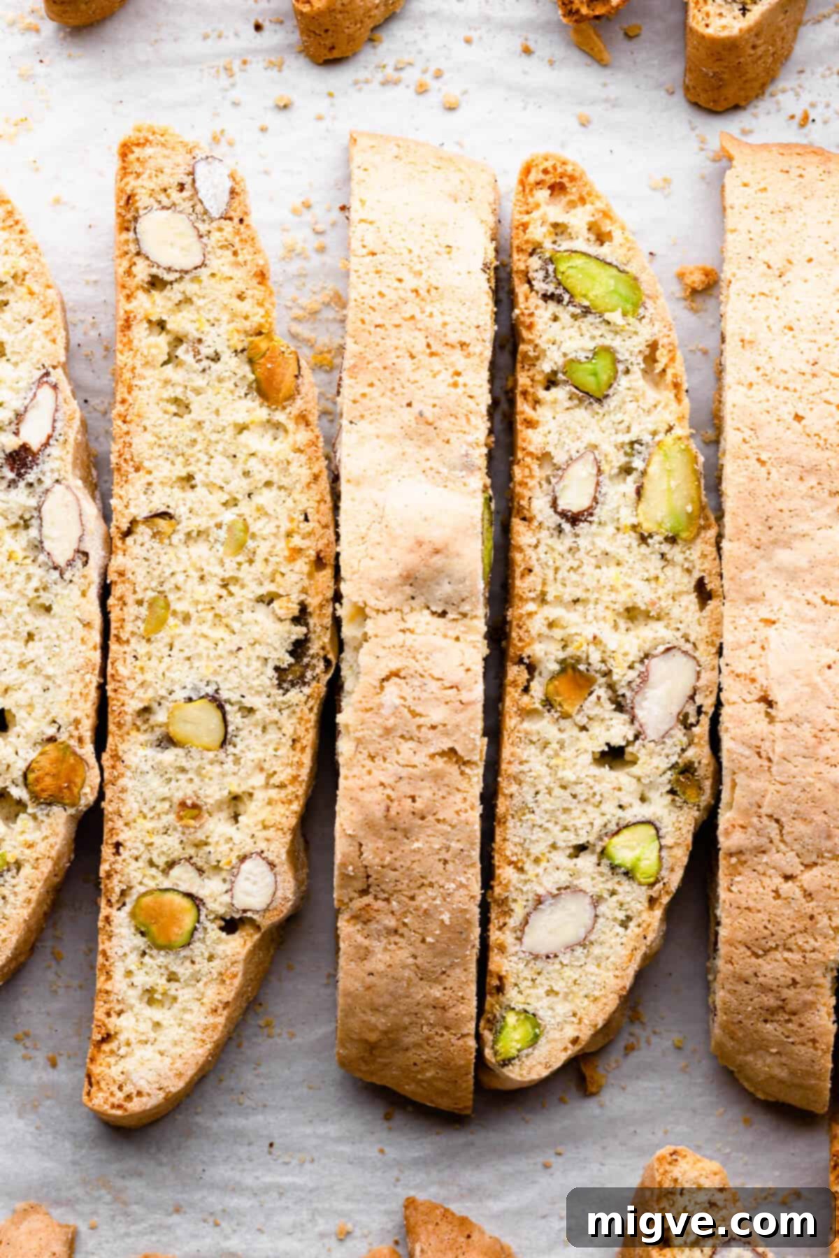 top view close up at few slices of biscotti with pistachios and almonds