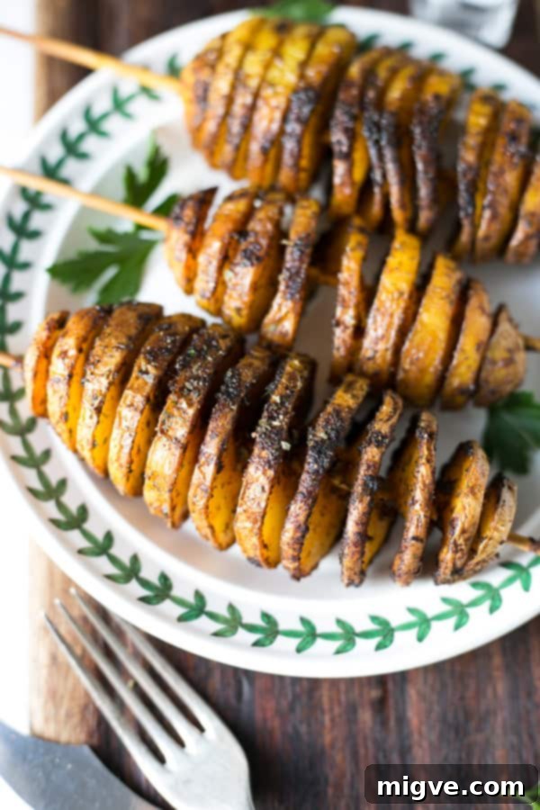 Golden Spiral Roasted Potatoes 5 Close-up of a perfectly spiralized Baked Tornado Potato, a crunchy and flavorful vegan snack.