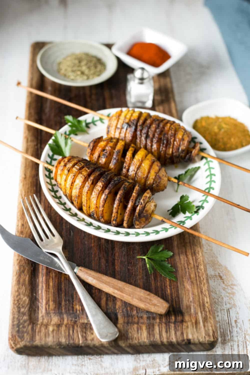 Golden Spiral Roasted Potatoes 10 A vibrant display of Baked 'Tornado' Potatoes, offering a crispy, spiral texture. A delicious vegan and dairy-free option for any meal.