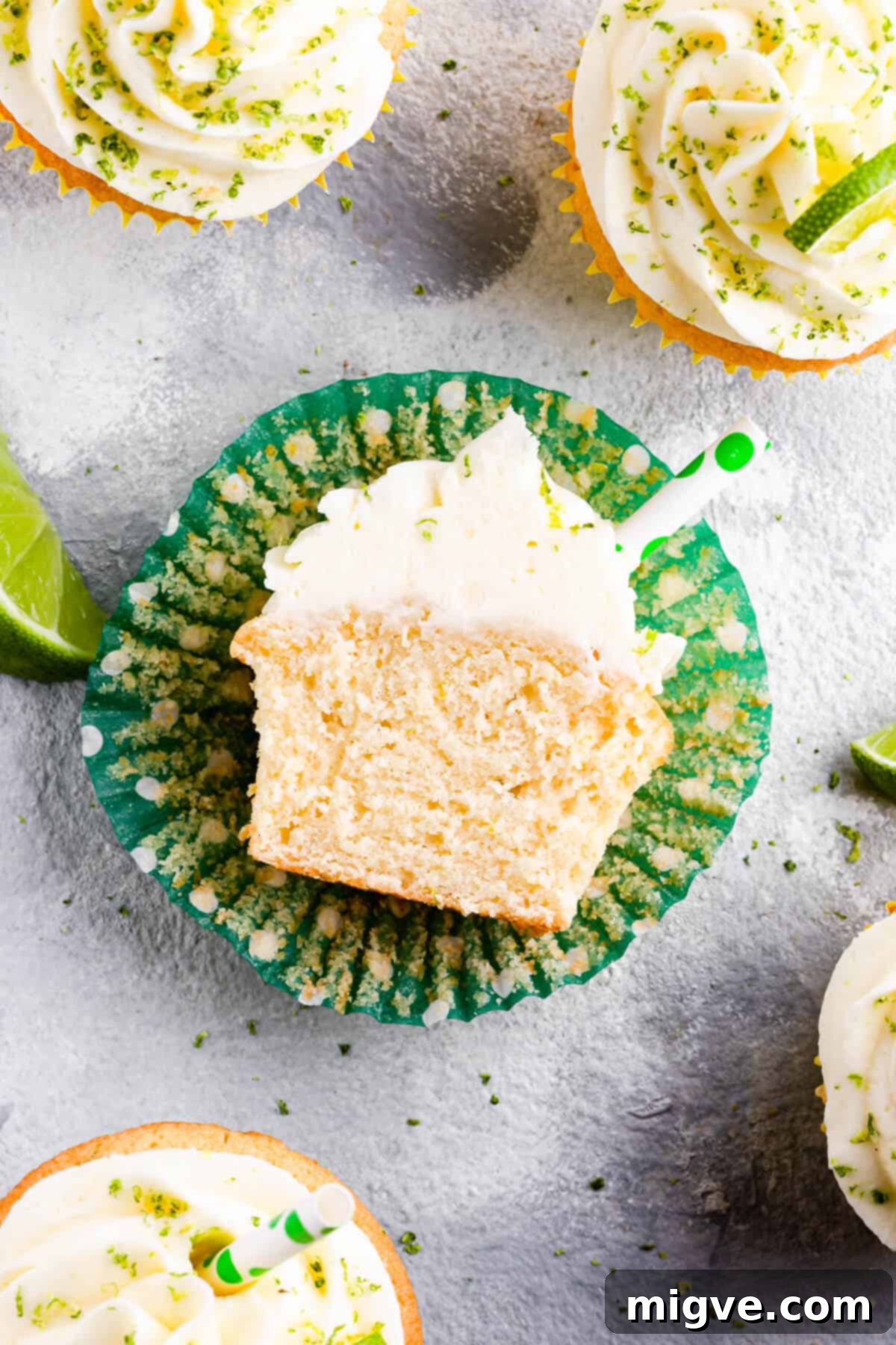 Top view of a Gin and Tonic Cupcake sliced in half, revealing its moist texture and uniform crumb.