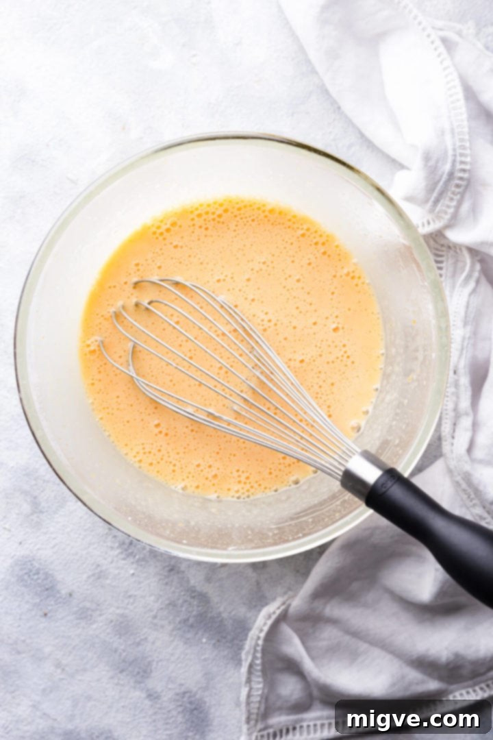top view of a glass bowl with egg mixture