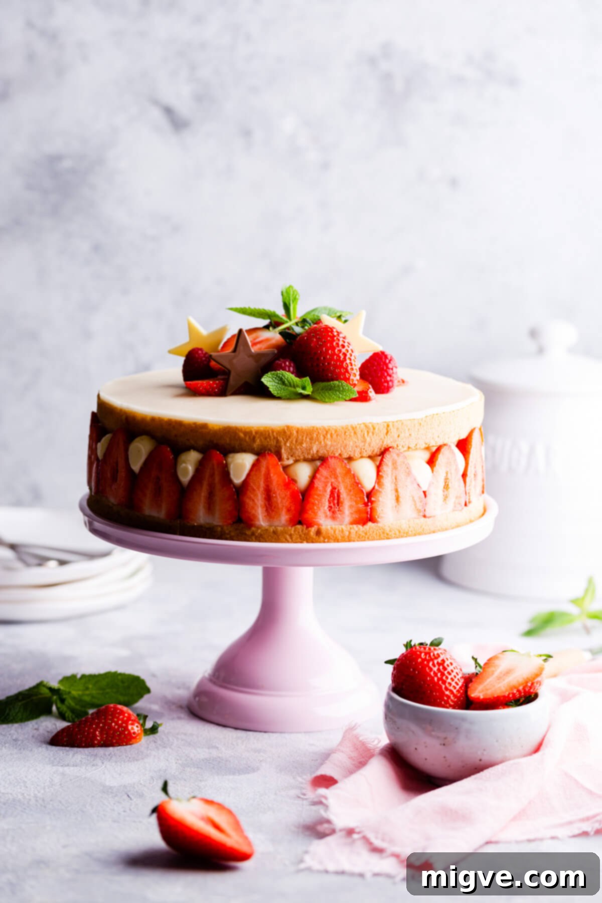 straight ahead view of a sponge cake with strawberries