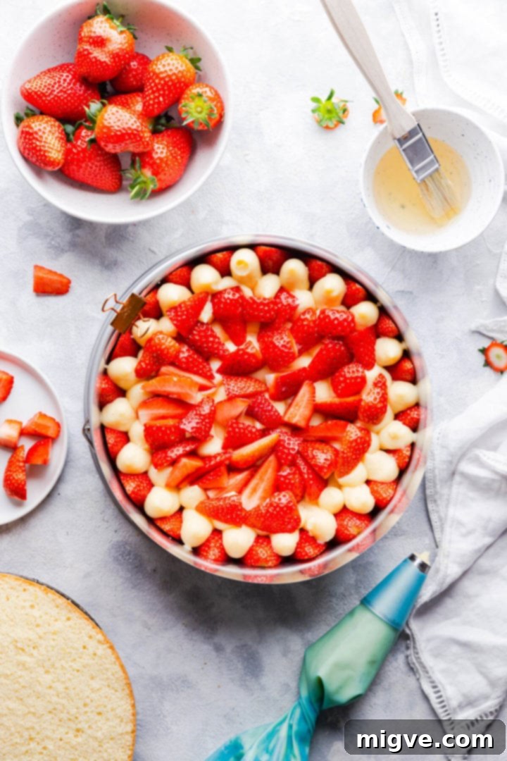overhead shot of sponge cake topped with fresh strawberries
