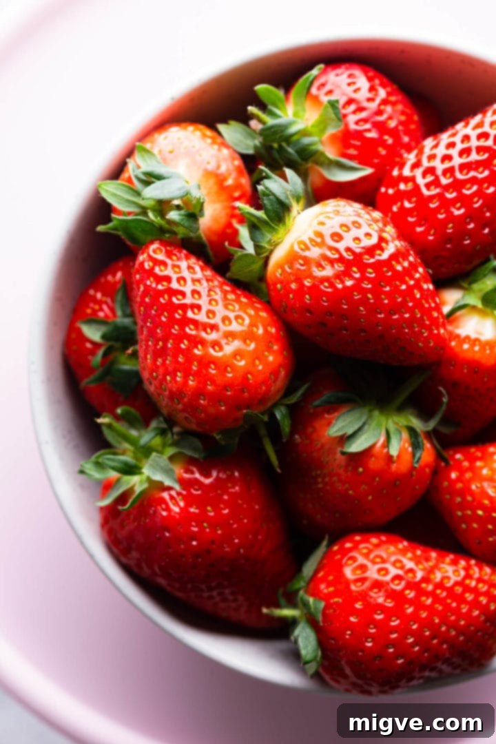 top view super close up of a bowl with fresh strawberries