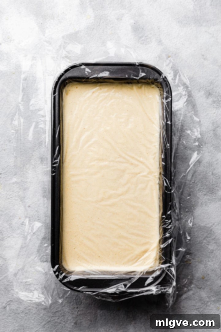 top view of container with ice cream mixture covered with clingfilm