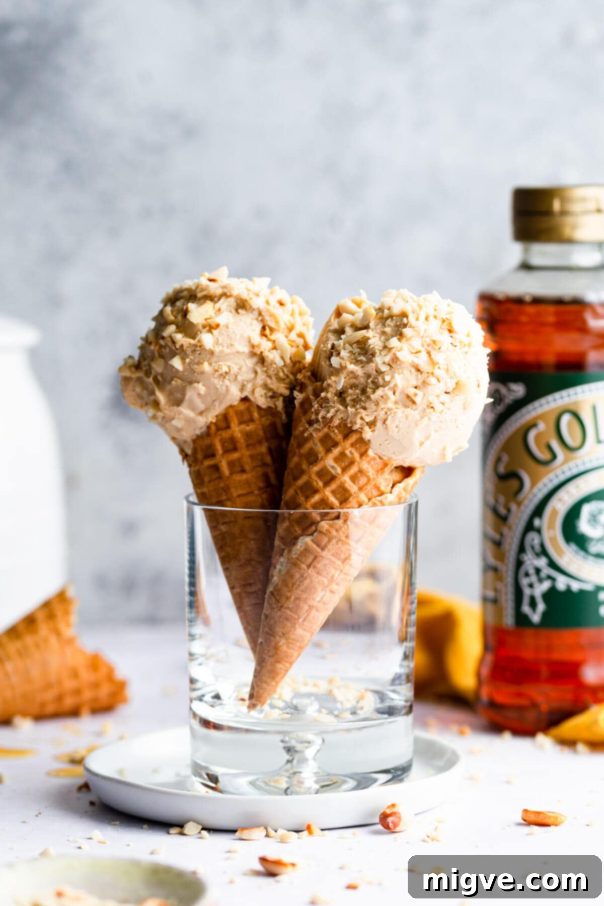 side close up at two peanut butter ice cream cones in a glass