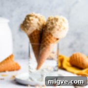 side super close up at two peanut butter ice cream cones inside of the glass
