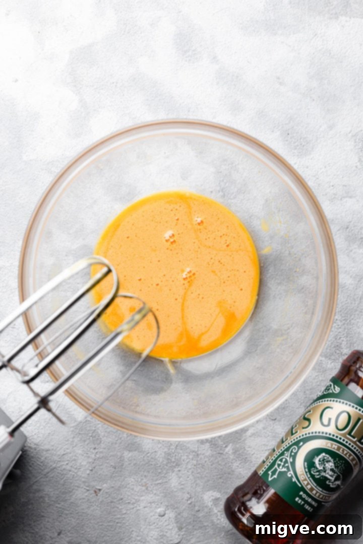 top view of glass bowl with whipped egg yolks