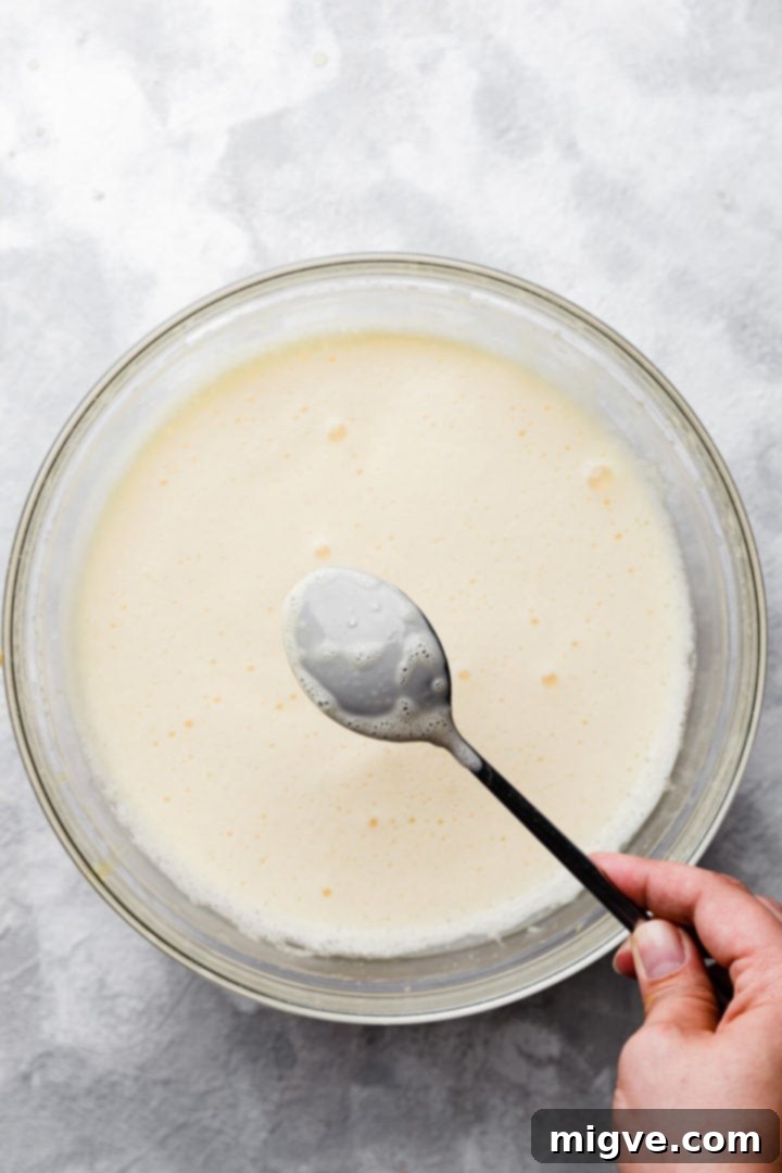top view of the back of the spoon coated with ice cream mixture